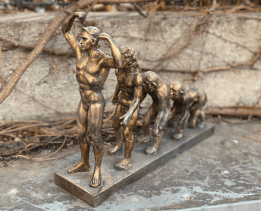 Man's Evolution Statue at online8 furniture store Auckland