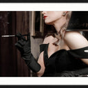 Quellazaire framed wall art, low lit reclining figure in a black frame with white mat