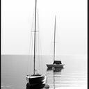 Becalmed canvas wall art of two yachts on flat calm water in black and white, black L-frame