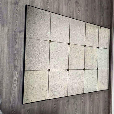 Antiques panelled wall mirror shown in a room setting