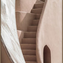 Rising canvas wall art of a curving staircase in warm terracotta tones, oak L-frame