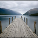 Nelson Lakes canvas wall art of the Lake Rotoiti jetty with mountains behind, black L-frame