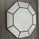 Octavia octagonal wall mirror shown in a room setting