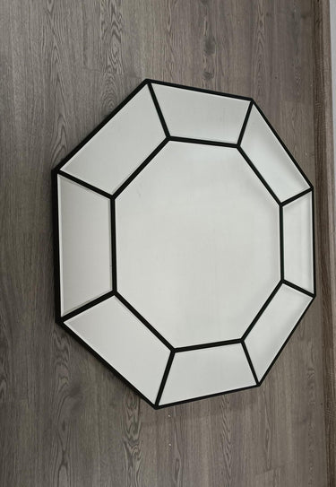 Octavia octagonal wall mirror shown in a room setting