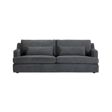 The Rhys 3-Seater Sofa in greyed green over a solid NZ pine frame with webbing suspension